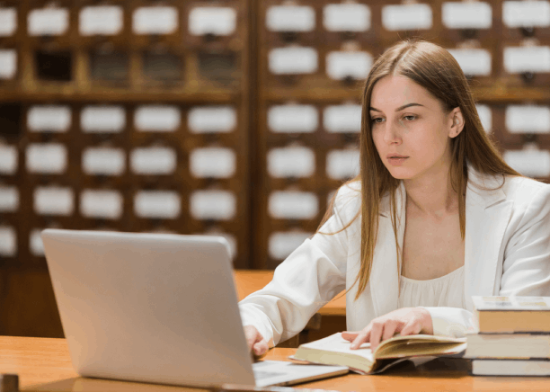 A graduate student edits a thesis while Portuguese Translation Services in Massachusetts support accurate academic citations.