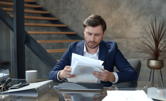 A translator delivers certified pages to a client, showing Translation Services in Boston with fast turnaround support.