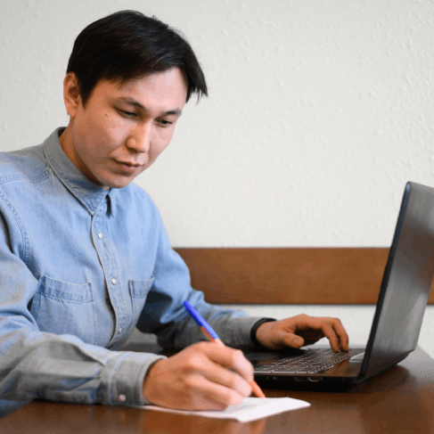 A manager signs a bilingual contract after Chinese Translation Services in Massachusetts delivers certified business text.