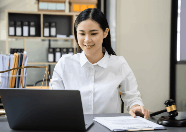 Lawyer reviews a bilingual contract with Chinese Translation Services in Massachusetts, ensuring precise legal wording.