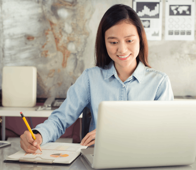 A linguist reviews handwritten notes for certified Chinese Translation Services in Massachusetts.
