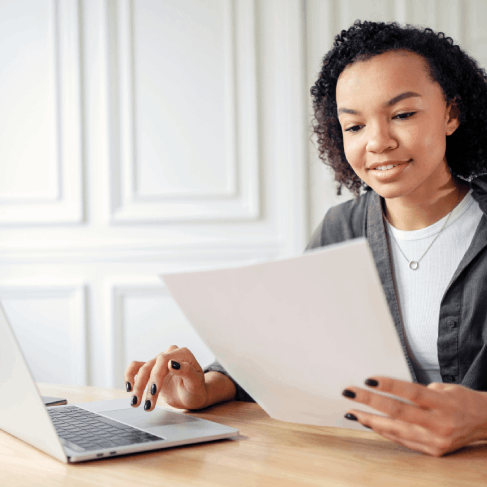A client reviews a USCIS-certified immigration translation from Haitian Creole Translation Services in Massachusetts.