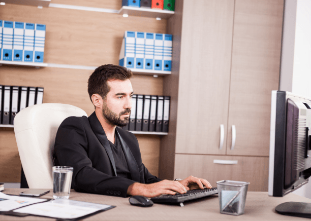 A manager proofreads translated business emails, showing Translation Services in Quincy for clear industry communication.