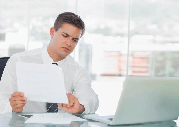 A project manager reviews a glossary and layout using Translation Services in Lynn for industry documents before release.