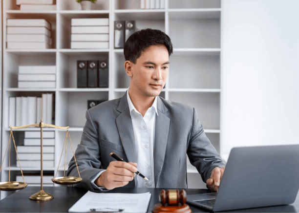 Lawyer reviews a bilingual contract in an office, using Translation Services in Newton for accurate legal compliance.