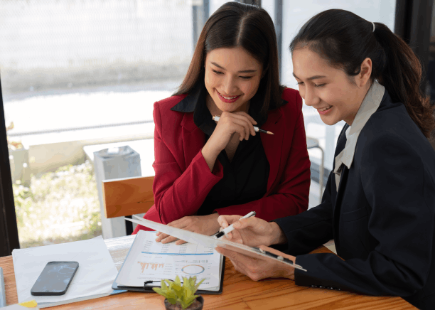 Two translator point at clauses on an agreement as Vietnamese Translation Services in Massachusetts delivers a legal.