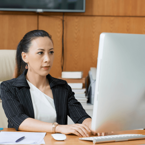 A translator reviews a birth certificate as Translation Services in Malden delivers fast and reliable individuals results.