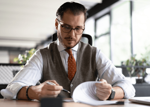 Account manager reviews a business contract for Translation Services in Medford, ensuring accurate and secure delivery.