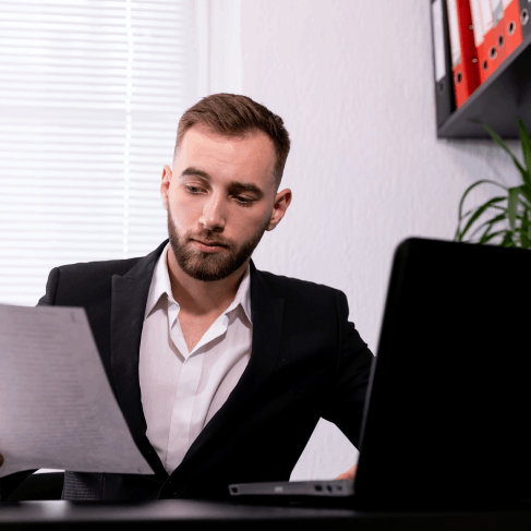 Translator checks a personal contract at a desk for Translation Services in Newton, ensuring clear document wording.