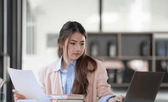 A translator formatting for reliable Translation Services in Lynn, preparing clean copies for submission.