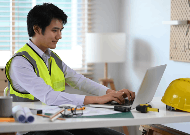 Engineer reviews a Portuguese manual with Portuguese Translation Services in Massachusetts for technical documents accuracy.