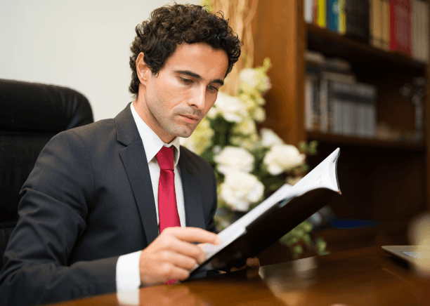 Lawyer reviews a translated contract, showing legal Translation Services in Somerville with certified wording and seals.