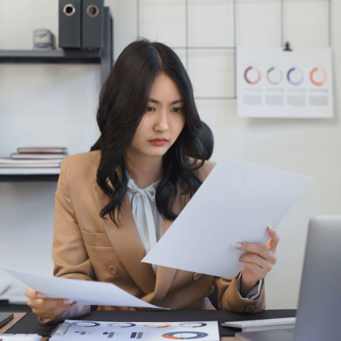 A translator proofreads a legal affidavit using Translation Services in Medford, checking terms and formatting line by line.