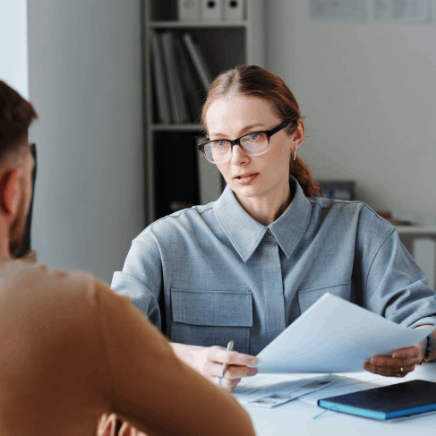 A translator compares originals to drafts as Translation Services in Lynn ensures USCIS compliance for legal filings.